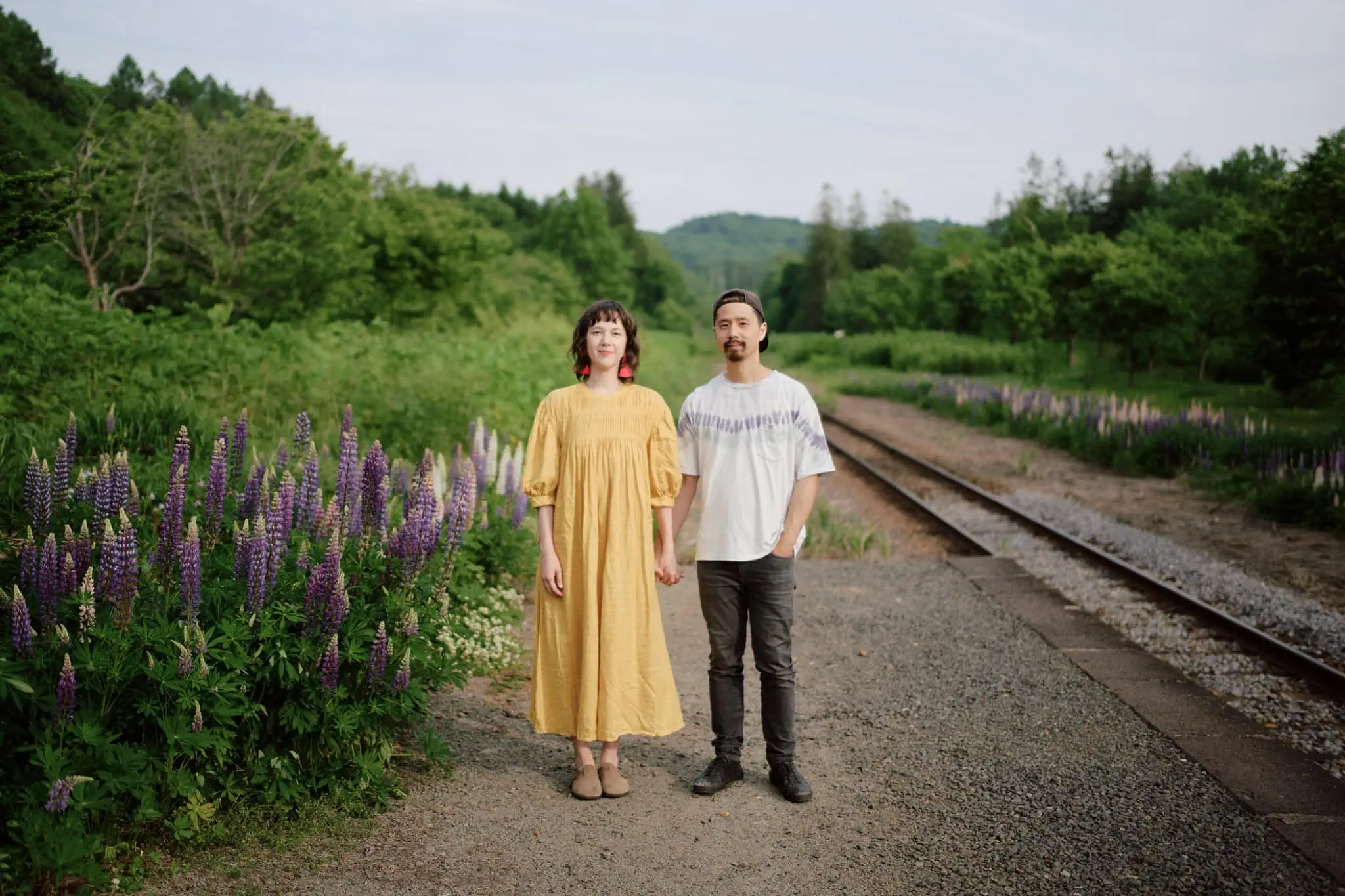 Couple in lupin fields Niseko Hokkaido Japan